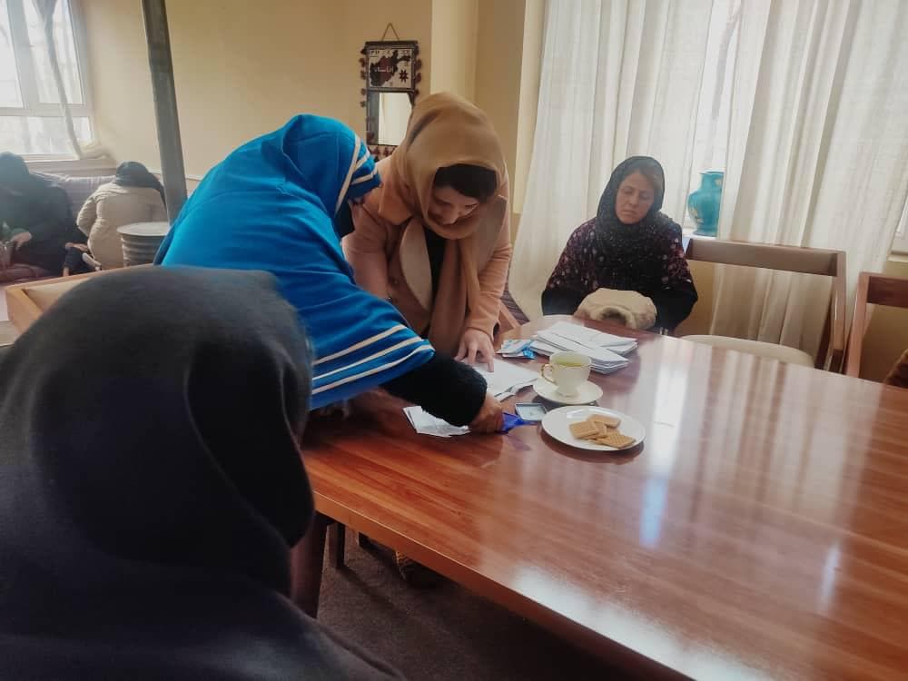 ABAAD team distributing relief to families